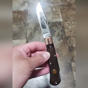 Cutco Folding Knife with Brown Handle and Silver Blade